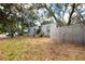 Shipping container home with a fenced yard and mature trees at 5021 69Th N Way, St Petersburg, FL 33709