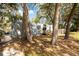 Shipping container home with a ramp and mature trees at 5021 69Th N Way, St Petersburg, FL 33709