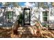 Modern container home exterior with wood deck and landscaping at 5021 69Th N Way, St Petersburg, FL 33709