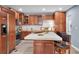 Modern kitchen with wood cabinets, stainless steel appliances and an island at 5021 69Th N Way, St Petersburg, FL 33709