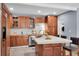 Modern kitchen with wood cabinets, stainless steel appliances and an island at 5021 69Th N Way, St Petersburg, FL 33709