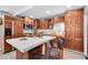 Modern kitchen with wood cabinets, stainless steel appliances and an island at 5021 69Th N Way, St Petersburg, FL 33709