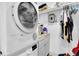 Laundry room with a washer, dryer and storage shelves at 5021 69Th N Way, St Petersburg, FL 33709