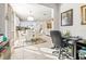 Bright dining area with kitchen views, seating for six, and home office space at 5124 Highland Pointe Ct, Wimauma, FL 33598