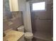 Bathroom with shower stall, toilet, sink, and grab bars at 6000 20Th N St # 114, St Petersburg, FL 33714