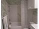 Clean bathroom with tiled shower/tub, and updated vanity at 6000 20Th N St # 114, St Petersburg, FL 33714