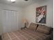 Spacious bedroom with a dresser, double bed, and closet at 6000 20Th N St # 114, St Petersburg, FL 33714