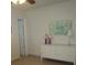 Bedroom with a dresser, artwork, and ceiling fan at 6000 20Th N St # 114, St Petersburg, FL 33714