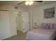 Bedroom with a double bed, nightstand, and closet at 6000 20Th N St # 114, St Petersburg, FL 33714