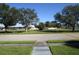 Community view with mature trees and road at 6000 20Th N St # 114, St Petersburg, FL 33714