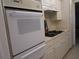 White built-in oven and microwave in a bright kitchen at 6000 20Th N St # 114, St Petersburg, FL 33714