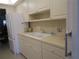 Kitchen features white cabinets, a double sink, and ample storage at 6000 20Th N St # 114, St Petersburg, FL 33714
