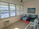 Relaxing sunroom with daybed and access to outside at 6000 20Th N St # 114, St Petersburg, FL 33714