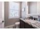 Clean bathroom with granite countertop and modern fixtures at 6010 Kipps Colony E Dr, Gulfport, FL 33707