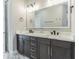 Modern bathroom with double vanity and quartz countertop at 6010 Kipps Colony E Dr, Gulfport, FL 33707