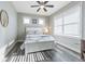 Bright bedroom with white bed frame and window blinds at 6010 Kipps Colony E Dr, Gulfport, FL 33707