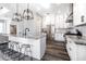 A kitchen featuring an island with bar seating, granite countertops, stainless steel appliances, and pendant lighting at 6010 Kipps Colony E Dr, Gulfport, FL 33707