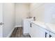 An organized laundry room has a washer and dryer, counter space, and storage at 6010 Kipps Colony E Dr, Gulfport, FL 33707