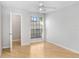 Bedroom with wood-look floors, ceiling fan, and walk-in closet at 8609 Mallard Reserve Dr # 202, Tampa, FL 33614