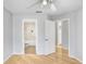 Bedroom with wood-look floors and an ensuite bathroom at 8609 Mallard Reserve Dr # 202, Tampa, FL 33614