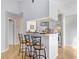 Kitchen with white cabinets, marble countertops, and breakfast bar at 8609 Mallard Reserve Dr # 202, Tampa, FL 33614