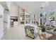 Grand living room featuring high ceilings, fireplace, large windows, and open layout at 8609 Mallard Reserve Dr # 202, Tampa, FL 33614