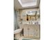 Bright bathroom showcasing a vanity with a white countertop and a skylight at 1221 Drew St # E11, Clearwater, FL 33755