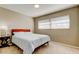 Bedroom with double bed, nightstand and window blinds at 1221 Drew St # E11, Clearwater, FL 33755