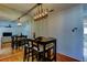 Dining area with mirrored wall, table and chairs, and view to living room at 1221 Drew St # E11, Clearwater, FL 33755