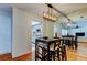 Dining area with mirrored wall and view of kitchen and living room at 1221 Drew St # E11, Clearwater, FL 33755