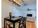 Bright dining area with table and chairs, adjacent to living room and kitchen at 1221 Drew St # E11, Clearwater, FL 33755