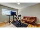 Home exercise room with stationary bike and couch at 1221 Drew St # E11, Clearwater, FL 33755