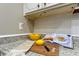 Kitchen counter with cookbook, cutting board, and fresh lemons at 1221 Drew St # E11, Clearwater, FL 33755