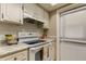 White kitchen with stove, oven, and cabinets at 1221 Drew St # E11, Clearwater, FL 33755
