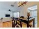Open-concept living room and dining area with hardwood floors and modern lighting at 1221 Drew St # E11, Clearwater, FL 33755