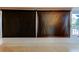 Enclosed lanai featuring tile flooring, a wall, and covered window treatments at 1221 Drew St # E11, Clearwater, FL 33755