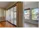 Sunroom with tile floors and sliding glass doors leading to outdoor balcony at 1221 Drew St # E11, Clearwater, FL 33755