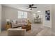 Light and airy living room featuring a neutral color palette and ceiling fan at 1303 E Frierson Ave, Tampa, FL 33603