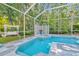 Screened pool and spa with a pergola and lush landscaping at 14117 Lincolnshire Ct, Tampa, FL 33626