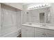 Updated bathroom with double vanity and shower/tub combo at 14905 Aire Pl, Tampa, FL 33624