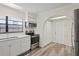 Modern kitchen with stainless steel appliances and white cabinets at 14905 Aire Pl, Tampa, FL 33624