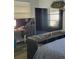 Bedroom with large TV, computer desk and gaming chair at 1707 New Bedford Dr, Sun City Center, FL 33573