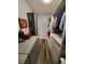 Large walk-in closet with built-in shelving and hanging rods at 1707 New Bedford Dr, Sun City Center, FL 33573