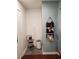 Entryway with dehumidifier, storage, and vintage stool at 1707 New Bedford Dr, Sun City Center, FL 33573