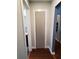 Clean hallway with modern door and bamboo flooring at 1707 New Bedford Dr, Sun City Center, FL 33573