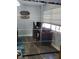 Bright home office features built-in mirrored closet and wood-look flooring at 1707 New Bedford Dr, Sun City Center, FL 33573