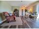 Bright living room with hardwood floors and comfy seating at 1707 New Bedford Dr, Sun City Center, FL 33573