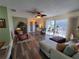 Spacious living area with hardwood floors and ample natural light at 1707 New Bedford Dr, Sun City Center, FL 33573
