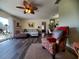 Bright living room with hardwood floors and comfortable seating at 1707 New Bedford Dr, Sun City Center, FL 33573