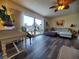 Living room featuring hardwood floors, and ample natural light at 1707 New Bedford Dr, Sun City Center, FL 33573